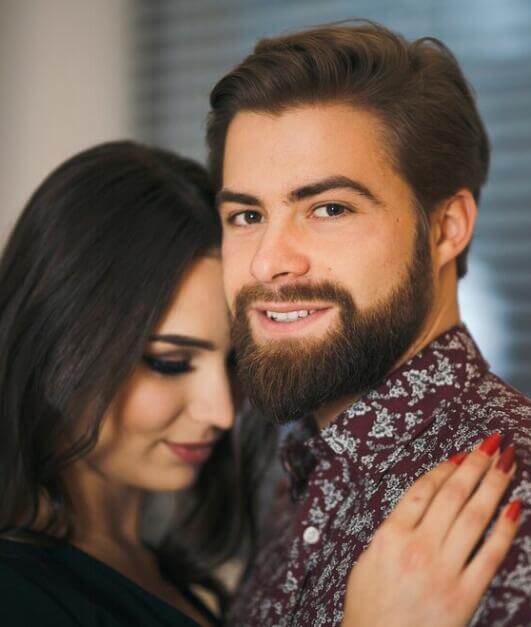 Couple image showing a softer editorial tone on the homepage